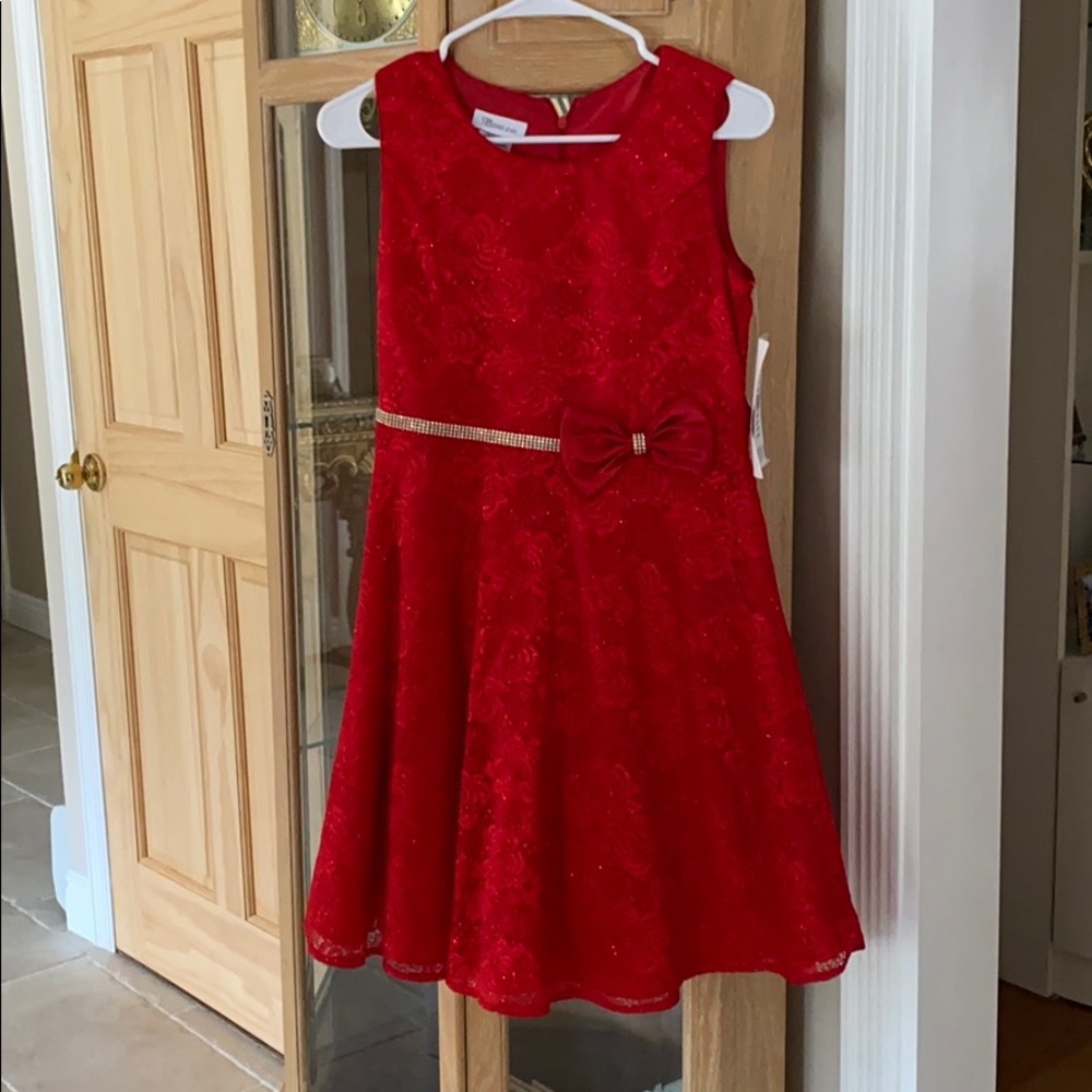 Red holiday dress with satin bow and rhinestone